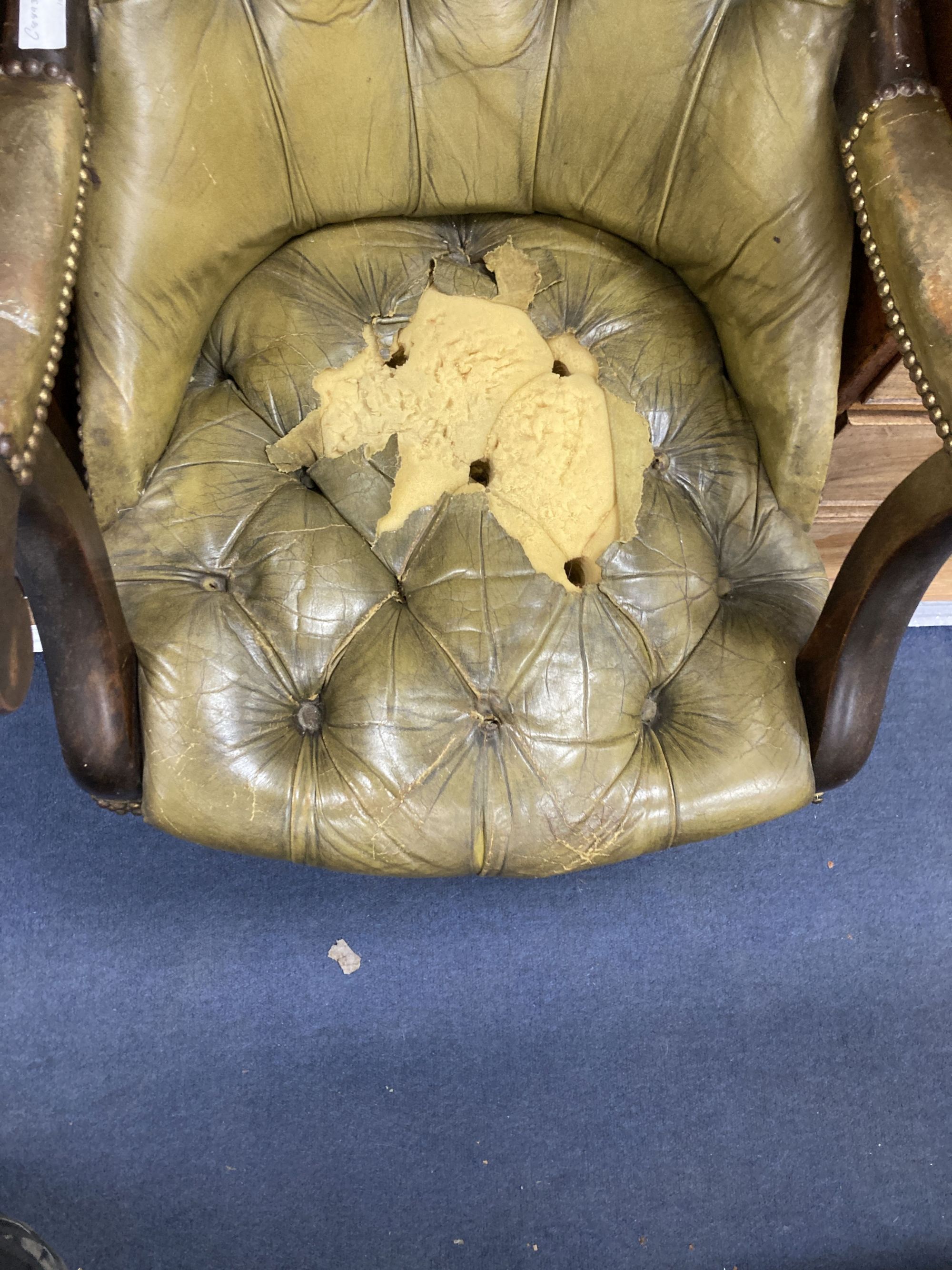 An early Victorian mahogany library armchair, upholstered in pale green leather, width 59cm, depth 84cm, height 104cm